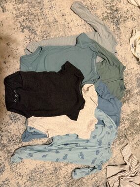 cloud island baby one-piece footies in black, gray, blue, teal, and light blue